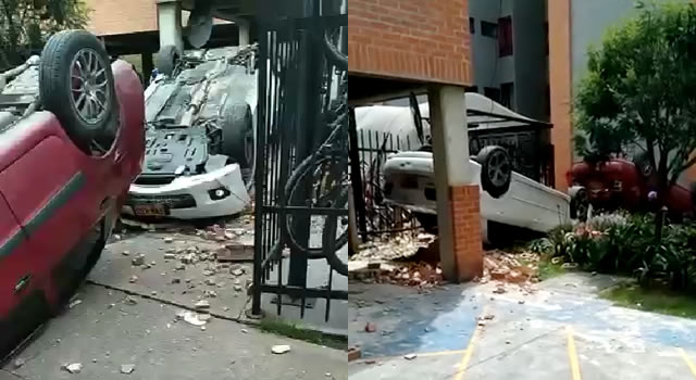 [VIDEO] Dos vehículos caen de un parqueadero y ocasionan fuerte accidente en Bogotá