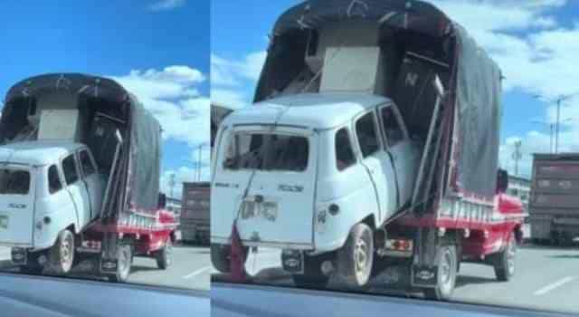 Camión de trasteo cargó a un vehiculo tipo Renault en una vía de Bogotá